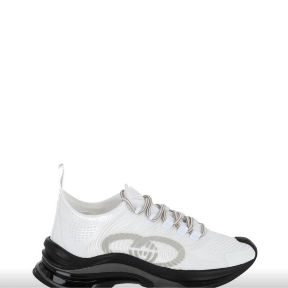 Gucci Sneakers . Chic White Sneakers with Black Soles.